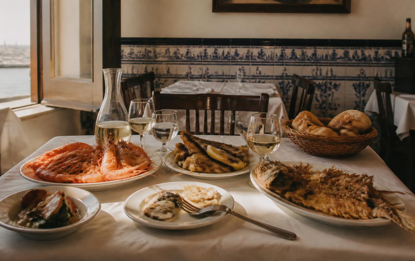 Traditional Cádiz seafood spread on a white tablecloth