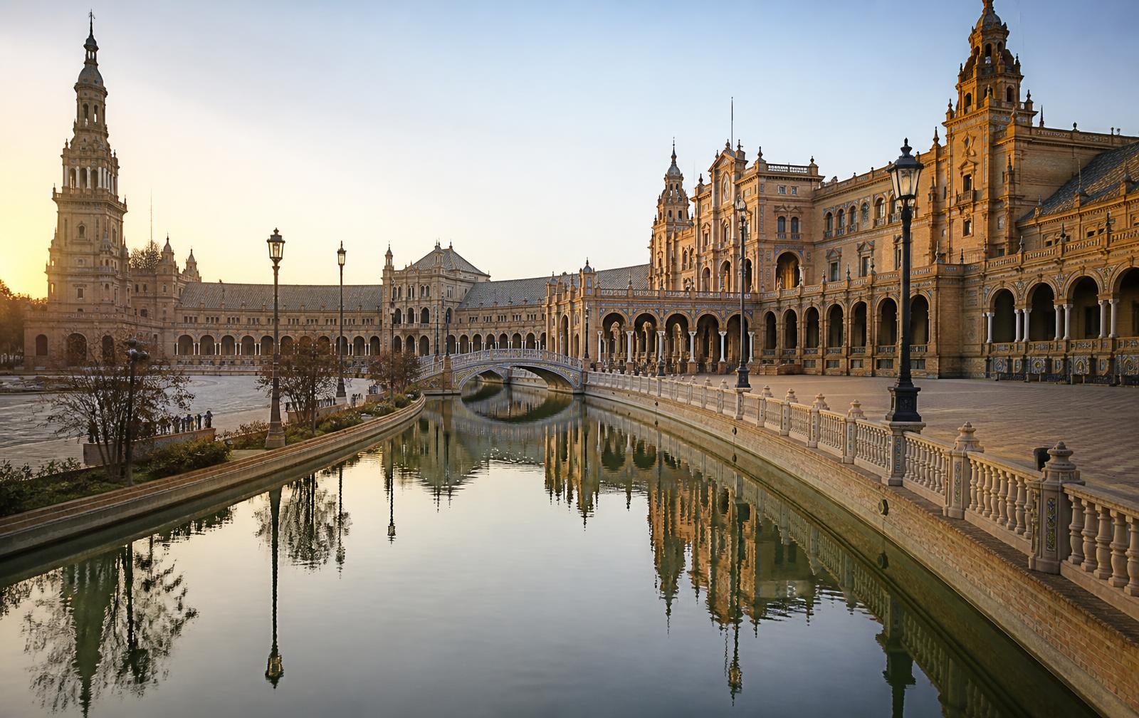 Plaza de España in Seville with its canal and tiled bridges at first light